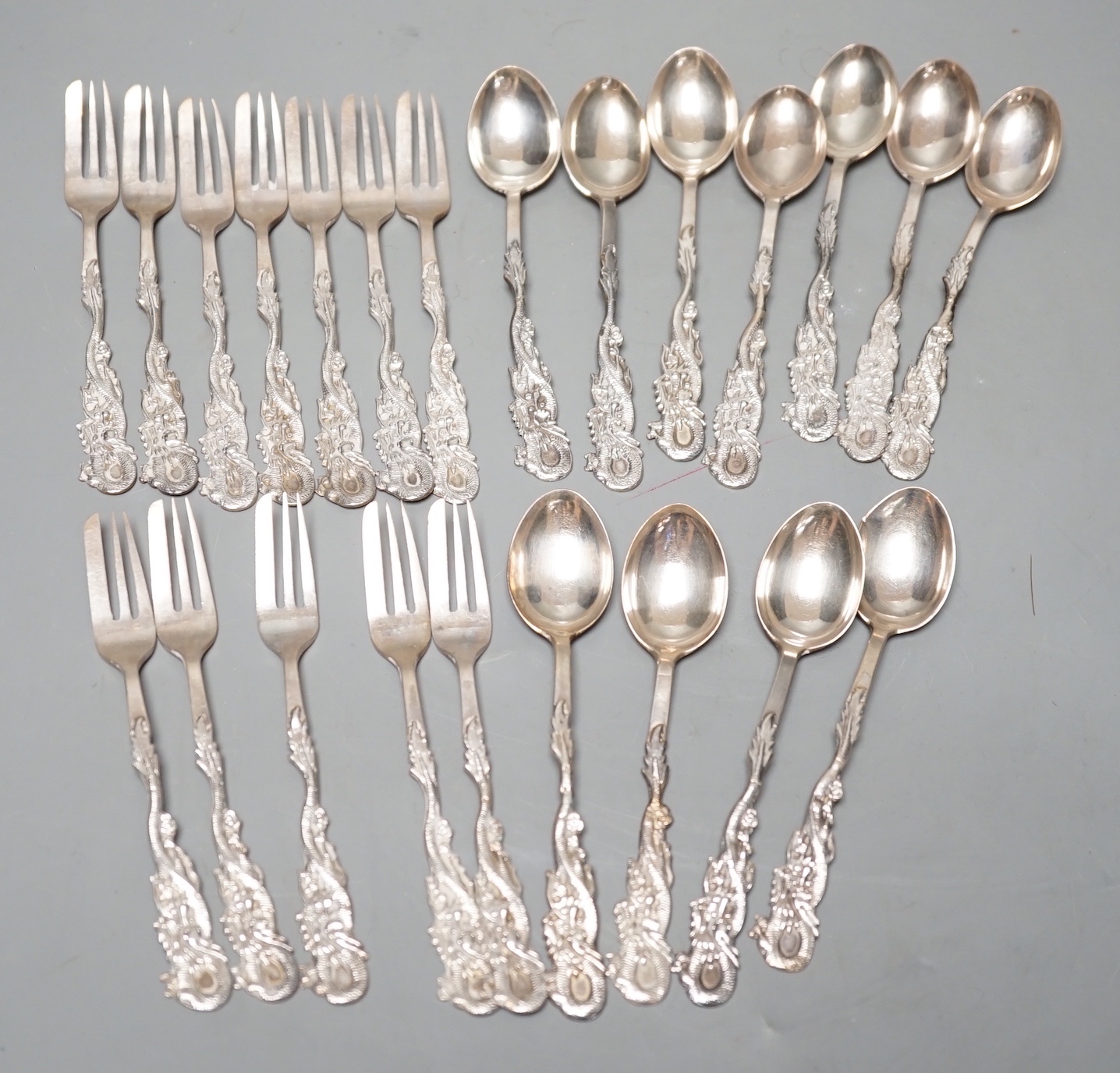 A set of twelve Chinese sterling tea forks, with dragon handles by YCCo and eleven similar teaspoons, 8oz.